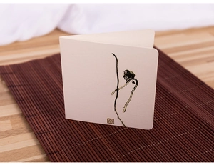 Artistic ink wash greeting card with Zen seal on bamboo mat background