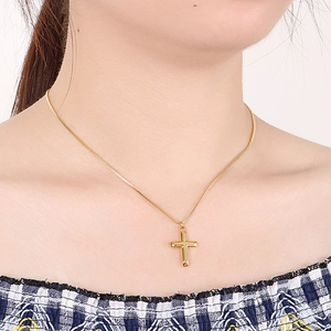 Minimalist gold cross necklace for women made of polished stainless steel for daily wear