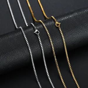 Close-up of gold and silver stainless steel box chains with secure lobster clasps
