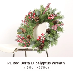 Detailed 50cm Christmas wreath with PE pine needles, red berries, and snow accents