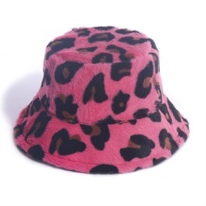 Detail of pink leopard print faux fur bucket hat with soft plush texture and warm material