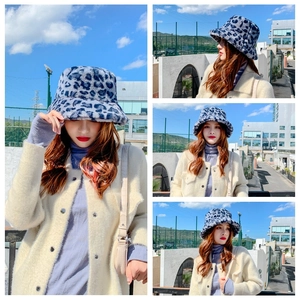 Detailed close-up of blue leopard print faux fur bucket hat with soft plush texture