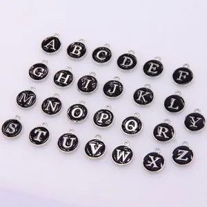 26-piece set of round alloy letter pendants with black enamel finish and silver A-Z initials