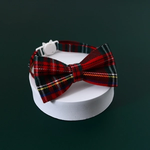 Classic plaid pet collar with bowknot and cat-shaped buckle on a display stand