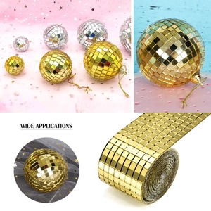 Close-up of gold self-adhesive mirror mosaic tape and reflective disco ball decor