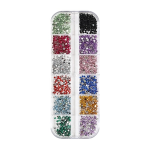 12-grid box of colorful glass rhinestones and flatback pearls for nail art decoration