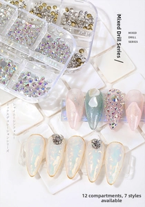 Close-up of 12-grid nail art kit featuring assorted rhinestones, mixed pearls and glitters