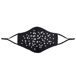 Detail of black silk face mask with elegant pearl embellishments and adjustable ear loops