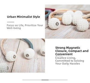Detail of pearl magnetic curtain tiebacks with woven rope on a light wood background
