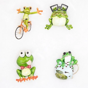 Set of four cute cartoon frog enamel pins in various playful poses on white background
