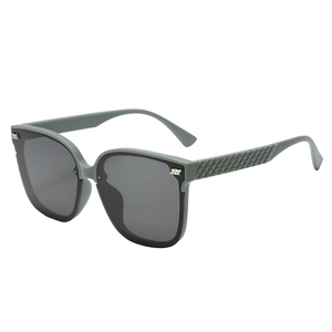 Lunettes de soleil oversize vert grisâtre avec branches tressées pour femmes stylées