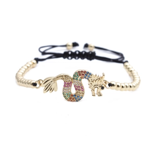 Golden dragon bracelet with colorful cubic zirconia and adjustable black woven cord