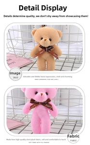 Close-up of soft plush teddy bear pendants with LOVE ribbons in brown and pink colors