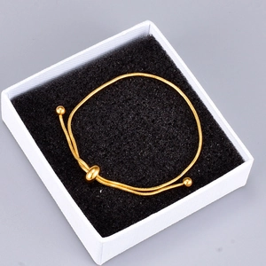 Golden snake chain bolo bracelet with adjustable sliding closure and round beads