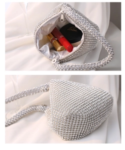 Detail showing interior capacity and silver rhinestone exterior of the evening bag