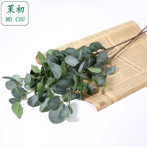 Detail showing artificial eucalyptus leaves with realistic veins on vintage paper