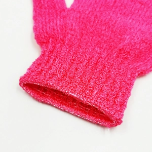 Bright pink exfoliating bath glove with high-elastic ribbed cuff and textured fabric