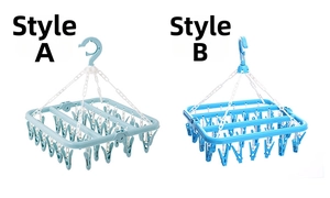 Detail view of foldable clothes drying racks in light green and blue with 32 clips