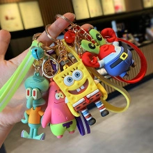 Set di quattro portachiavi in silicone con personaggi colorati e cinturini da polso