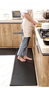 Detailed view of extra-thick anti-fatigue black kitchen floor mat with non-slip texture