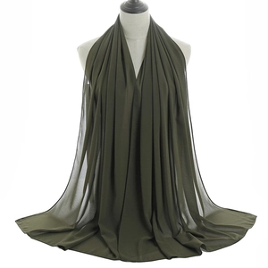 Front view of olive green chiffon hijab scarf draped on a mannequin head with fine texture