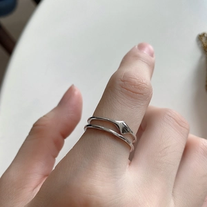 Minimalist double layer 925 sterling silver ring with irregular droplet charm on finger
