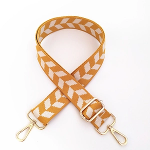 Adjustable geometric arrow strap with gold-tone swivel clips for crossbody bags