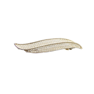 Elegant gold-tone leaf hair clip with white pearls on a clean white background