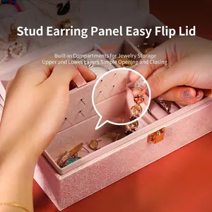 Pink PU leather jewelry organizer box with tiered compartments and golden metal lock