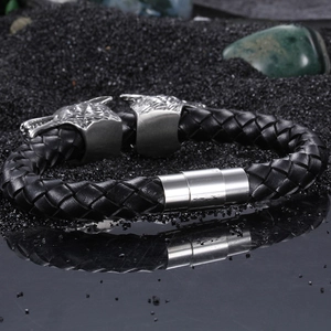Retro braided leather bracelet featuring silver stainless steel double wolf heads for men