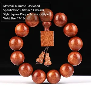 Makro-Detail von 18mm Myanmar-Palisander-Perlen mit Maserung und Holzanhänger