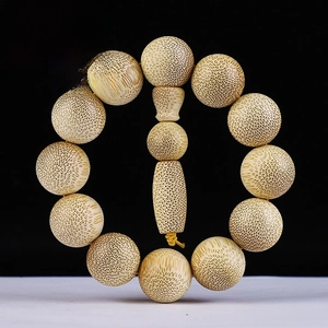 Macro shot of 20mm dragon blood golden silk bamboo beads with fine natural texture