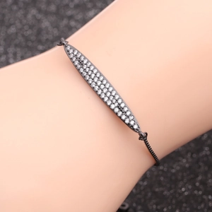 Minimalist black plated chain bracelet with a pavé zircon pointed spindle bar pendant