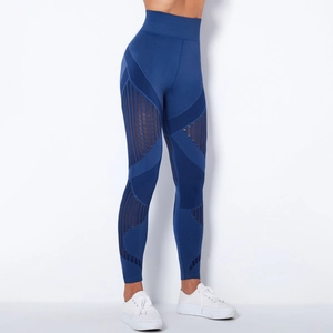 Detail view of dark blue seamless yoga leggings with breathable mesh stripe cutouts