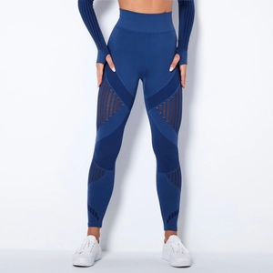 Detail view of seamless knit yoga pants with geometric mesh panels for breathability