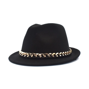 Classic black wool fedora hat with a bold gold chain band on a white background