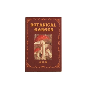 Vintage botanical garden paper notebook with red mushroom illustration on a red cover