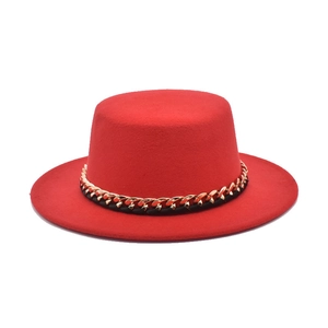 Red wool felt flat top boater hat featuring a bold gold chain band for men and women