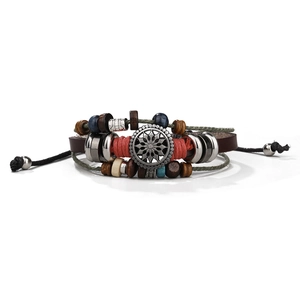Detail of multi-layer braided leather bracelet with turquoise and sunflower metal charm