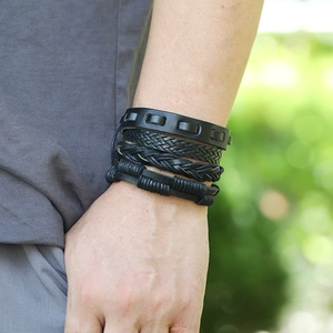Multi-layer black woven leather bracelet set for men featuring a vintage punk style