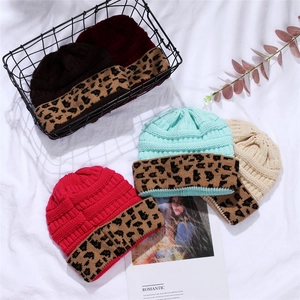 Knitted acrylic winter beanie hat with leopard print cuff detail in various colors
