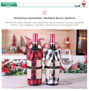 Detail view of red and white checkered collar wine bottle covers on white wooden surface