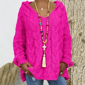 Close-up of rose red cable knit hoodie paired with a bohemian long beaded necklace