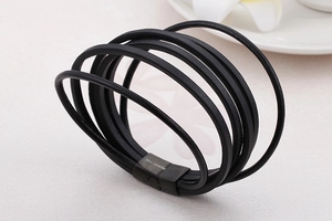 Macro view of multi-layer black braided leather bracelet with stainless steel magnetic clasp