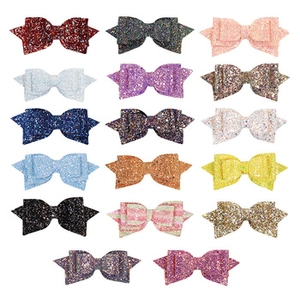 Detailed collection of 17 glitter Christmas hair bows in various vibrant colors