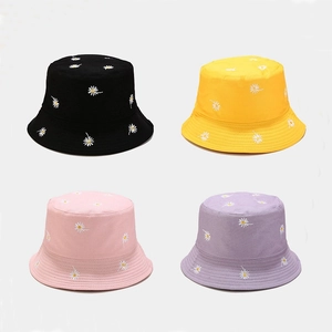 Daisy embroidered reversible bucket hats in black yellow pink and purple colors