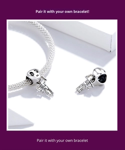 Macro detail of S925 sterling silver skull charm with pumpkin motif for bracelets