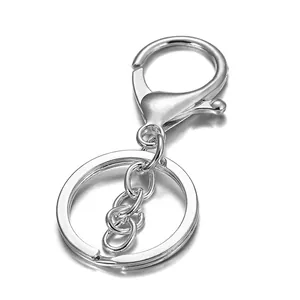 Detailed view of silver metal lobster clasp with flat ring connector for DIY keychains