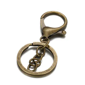 Detail of vintage bronze alloy lobster clasp with chain and split key ring hardware