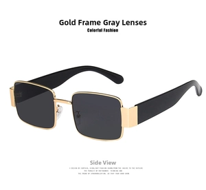 Detail of square sunglasses with gold metal frames, grey lenses and black temples